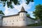 The fortress walls with towers around the ancient orthodox Andronikov Monastery. Architectural monument of the 14th century.