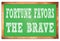 FORTUNE FAVORS THE BRAVE words on green wooden frame school blackboard