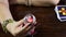 A fortune teller holds a magic ball.On the table are fortune-telling cards and lighted candle.Magic