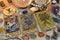 Fortune telling ritual with chakras on stones, tarot cards and runes on witch table