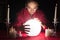 Fortuneteller Holding Hands Around A Glowing Ball