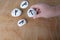 Fortuneteller`s hand explains the meaning of the Scandinavian, Slavic runes on flat stones for fortune-telling for the future, th