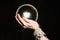 Fortuneteller's hands on a glass orb on black background. Prediction of the future