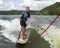 Forty-four year-old Caucasian male wake surfing at Grand Lake in Oklahoma.