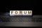 Forum word made of wood background. Business concept