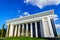 Forums Palace in Tashkent on a sunny day with cloudy sky.