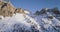 Forward aerial to snowy rocky mountain at falzarego pass.Sunset or sunrise, clear sky, sunny.Winter Dolomites Italian