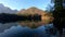 Forward moving left pan walkway at Laghi di Fusine lake on warm autumn day