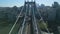 Forwards fly above large and wide Manhattan Bridge. Historic structure of suspension bridge connection urban districts