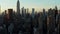 Forwards fly above street in city. High rise buildings reflecting bright sunshine at sunset time. Manhattan, New York