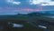 Forwards fly above tranquil morning preserved landscape in Iceland. Aerial hyper lapse footage of clouds floating on