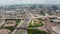 Forwards reveal of large multilane highway interchange. Aerial view of traffic in city at rush hour. Dallas, Texas, US.