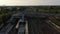 Forwards tracking of train arriving into station while tram crossing railway tracks over Bosebrucke bridge. City scene