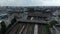 Forwards tracking view of train arriving into Hamburg Hauptbahnhof train station. Aerial shot of railway tracks and