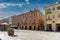 Fossano, Cuneo, Italy - February 27, 2022: the Town Hall building in via Roma between historic buildings with arcades