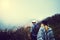 They found a beautiful pace to get lost in. Rearview shot of two unidentifiable young hikers walking along a mountain