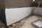 Foundation and basement thermal polystyrene insulation: Rigid eps foam  boards are installed before applying waterproofing