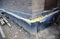 Foundation insulation as a part of house construction. A close-up of an insulated foundation with layers of sprayed tar,