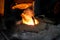 Foundry worker melting metal for casting spare parts