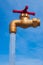 Fountain, against the blue sky, stylized as a tap with running water. The concept of global cleanliness and hygiene.