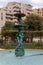 A fountain with apartments behind in Fontvieille Monaco