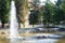 Fountain and bridge in park Giardini Pubblici in Trento, Italy