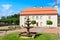 Fountain and building of the former barn. Catholic church.Liskiava. Lithuania