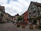 The Fountain in the center of Kaysersberg, surrounded by typical houses in rhenish style.