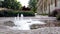 Fountain in the city on ground level, place for refreshment and rest