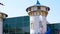 Fountain in the city park on the background of the children`s fairytale tower