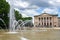 fountain and classicist facade of an Opera building in the city of Poznan