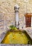 Fountain with drinking water in Inner Court of Chillon Castle