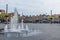 Fountain in the Dutch city of dordrecht on the market place with a cloudy overcast sky with lots of empty space and negative space