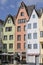 Fountain `Fish shops` against a backdrop of beautiful houses in the center of Cologne