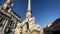 The fountain of the four rivers with the facade of the church of Santa Agnese in Piazza Navona in Rome