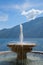 Fountain with garda lake background