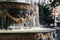 Fountain with with golden stucco and freeze water drops