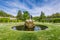 Fountain on green lawn in front of Wurzburg Residence palace