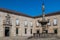 Fountain at Largo do Paco square in Braga with the Rectorate of the university of Minho, Portug