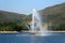 Fountain in a park with rainbow