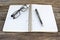 Fountain pen and spiral notebook with eyeglasses