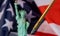 Fountain pen on an Usa flag stars and stripes on statue of liberty soft focus