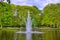 Fountain in the pond with green trees, Keukenhof Park, Lisse, Holland