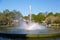 Fountain with rainbow in public flower garden Keukenhof. Popular tourist site. Lisse, Holland, Netherlands