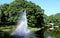 Fountain with a rainbow in Riga river canal