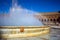 Fountain and rainbow on square of Spain in Seville, Spain