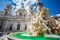 Fountain of rivers in Rome in Italy. In the background, the baroque church of Santa Agnese in Agone