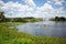 Fountain in a small pond or lake in Florida with tranquil landscaping in the background