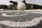 Fountain with sphere in white Carrara marble at the Olympic stadium in Rome