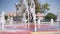 The fountain splashes outdoor in the town public park during summer season day holidays